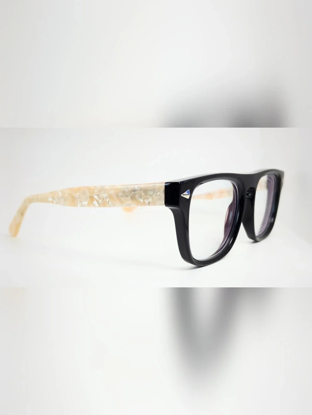 Fluoresce. Black Wayfarer-Style Eyeglasses with Pearl Temples.